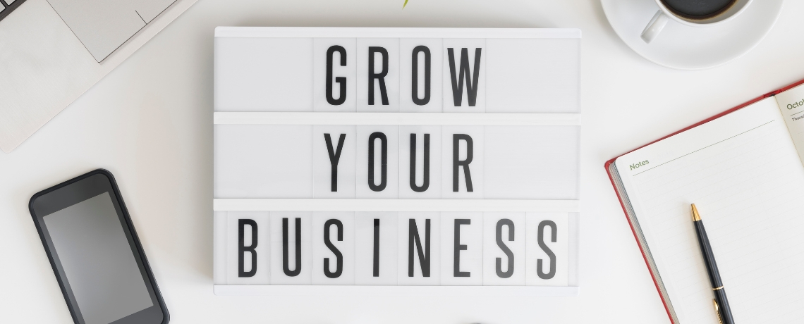 grow your business sign on table