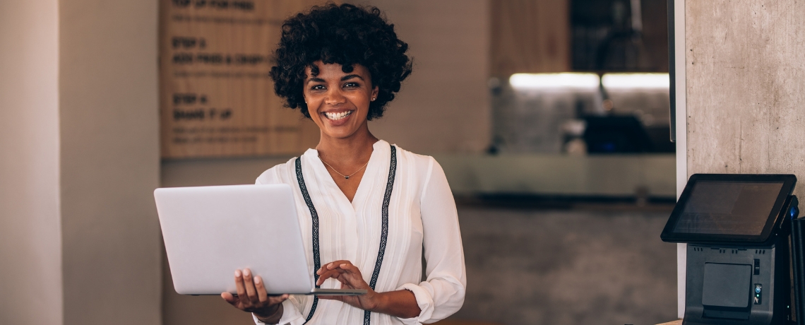 woman business owner with laptop